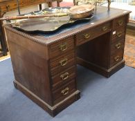 An Edwardian mahogany pedestal desk