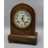 An inlaid dome topped clock