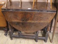 An 18th century oak gateleg table, W.94cm