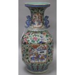 A Chinese celadon ground baluster vase, all-over polychrome-enamelled with flowers, insects, birds