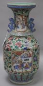 A Chinese celadon ground baluster vase, all-over polychrome-enamelled with flowers, insects, birds