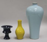 A Chinese blue-glazed stem cup, a yellow vase and a claire de lune glazed meiping