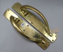 A pair of brass Art Nouveau door handles