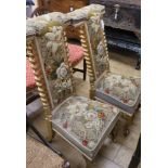 A pair of Victorian gilt wood and needlepoint prie dieu chairs