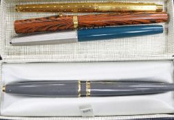 Three Parker pens and Waterman pen