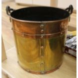 A copper and brass bucket