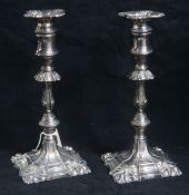 A 1960's pair of George III style silver candlesticks 9.5in.