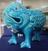 A Burmantofts turquoise toad spoon warmer