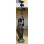 A figural candlestick