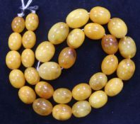 A single strand amber bead necklace, with hook clasp, gross 63 grams, 56cm.