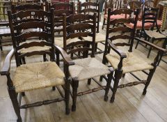 Six rush seat ladder back chairs (4 chairs and 2 carvers)