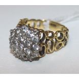 An 18ct gold and diamond cluster ring, size O.