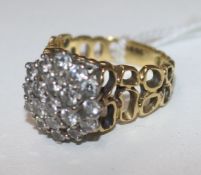 An 18ct gold and diamond cluster ring, size O.