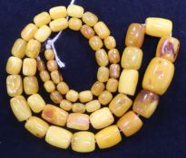 A single strand graduated barrel shaped amber bead necklace, gross 59 grams, 72cm.