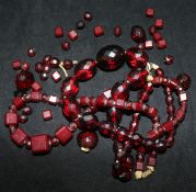 Two simulated red amber necklaces.