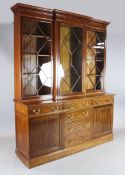 An Edwardian crossbanded mahogany library bookcase, the upper breakfront section with three astragal