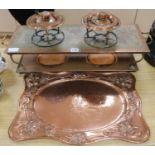 A copper hot plate with two spirit burners and tray