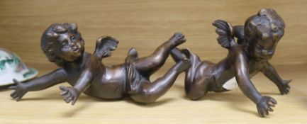 A pair of bronze cherubs