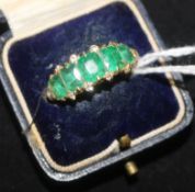 A gold and five stone emerald and diamond ring (stones badly worn, size O.