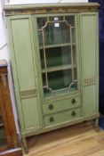 A George III style green painted and parcel gilt display cabinet, W.93cm