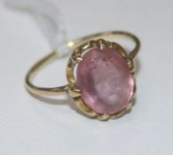 A gold and single stone pink topaz ring, (worn), size J.