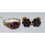 A 9ct gold gem set ring and a pair of 9ct gold and garnet ear clips.