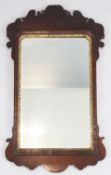 A George II walnut and parcel gilt fret framed wall mirror, W.2ft H.3ft 3in.