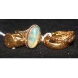 An 18ct signet ring, a 22ct gold band, an 18ct diamond chip ring and a 9ct opal ring.