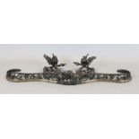 A Louis XV style pierced and cast iron serpentine fender, L.4ft 7in.