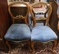 A set of three Victorian walnut salon chairs