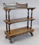 C. Hindley & Sons. A Victorian Aesthetic movement parcel ebonised walnut buffet, with three tiers