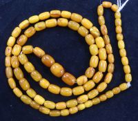 A single strand graduated barrel shape amber bead necklace, gross 29 grams, 86cm.