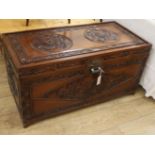 A Chinese relief carved camphorwood chest, W.104cm