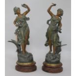 A pair of painted spelter figures "Melody and Poetry"