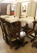 An oak draw leaf dining table and six chairs W.183cm