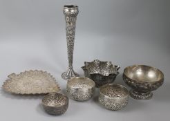 Seven assorted Indian white metal items including bowls, vases and dish.