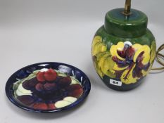 A Moorcroft table lamp and a plate