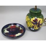 A Moorcroft table lamp and a plate