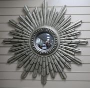 A silver painted starburst wall mirror, H.104cm