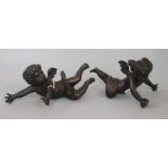 A pair of bronze cherubs