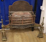 A George III brass mounted steel serpentine fronted fire grate W.105cm