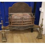 A George III brass mounted steel serpentine fronted fire grate W.105cm