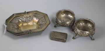 A 19th century silver snuff box, a pair of George III silver bun salts and a later silver