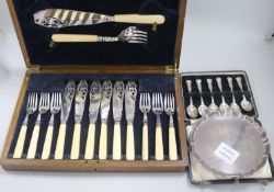 A George V silver waiter, a cased set of six silver spoons and a cased set of plated fish eaters