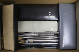 A group of fountain pens and two silver propelling pencils