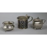 A Victorian silver mustard pot, a later silver mustard pot and a silver salt.