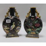 A pair of enamelled porcelain vases