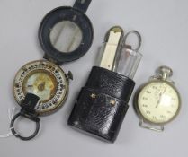 A compass, an etui and a military pilots stopwatch