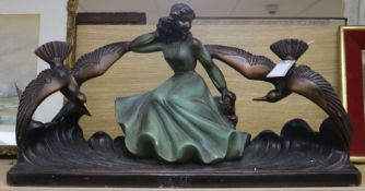 An Art Deco plaster model of a lady with birds