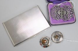 A silver engine-turned cigarette case, a Scottish silver cairngorm-set brooch, a similar brooch